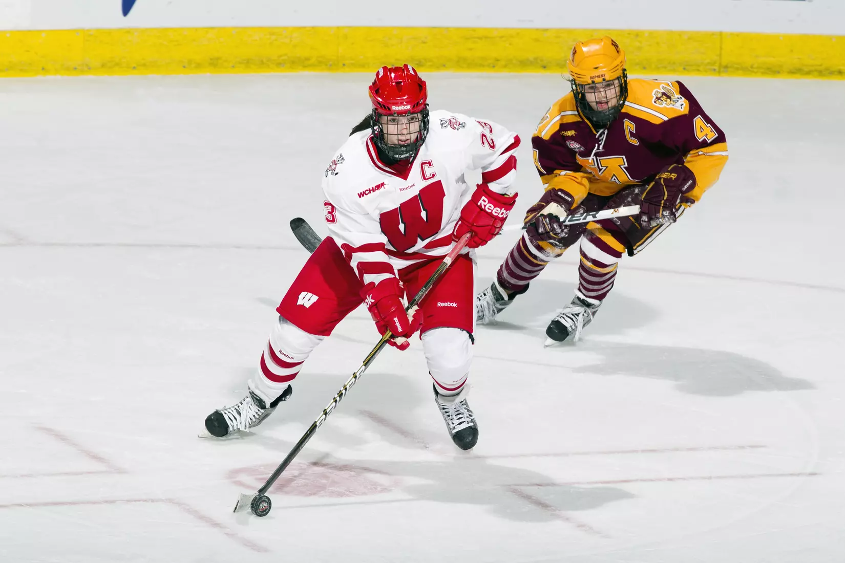 Wisconsin Badgers Hilary Knight (23) handles the puck during an NCAA women's hockey game against the Minnesota Golden Gophers on October 14, 2011 in Madison, Wisconsin. The Badgers won 3-2. (Photo by David Stluka)