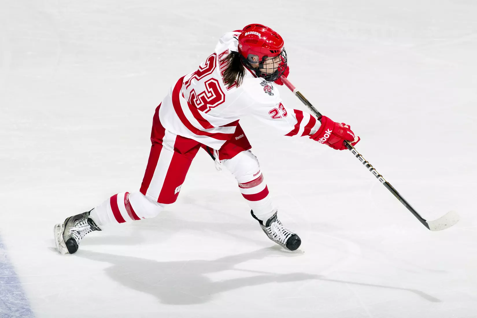 Wisconsin Badgers Hilary Knight (23) shoots the puck during an NCAA women's hockey game against the Minnesota Golden Gophers on October 14, 2011 in Madison, Wisconsin. The Badgers won 3-2. (Photo by David Stluka)