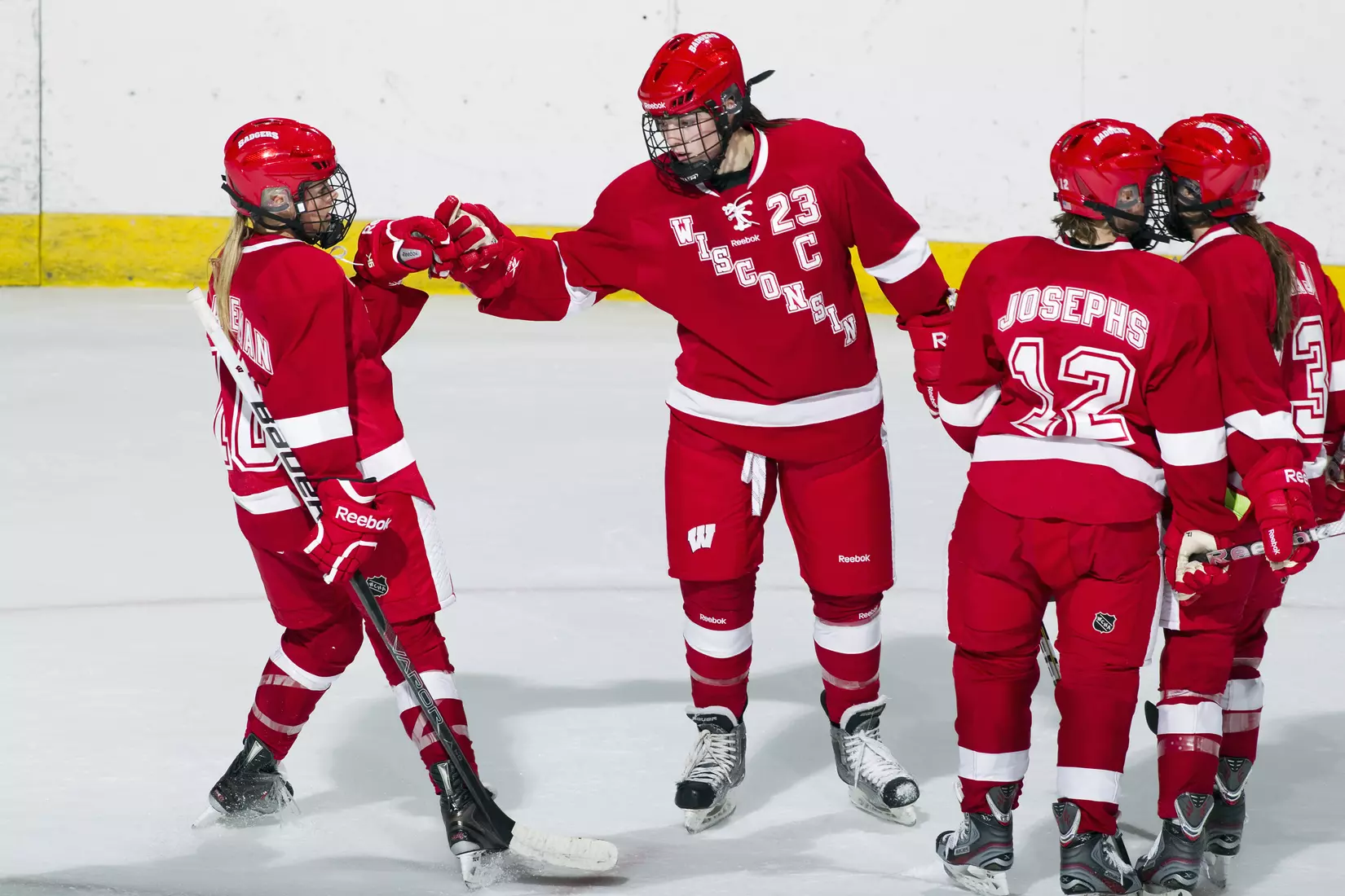 Wisconsin Badgers Hilary Knight (23) celebrates a goal with her teammates during an NCAA Women's College Hockey game against Lindenwood University Lions on September 23, 2011 in Madison, Wisconsin. The Badgers won 11-0. (Photo by David Stluka)