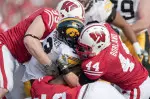 Chris Borland makes a tackle against Iowa
