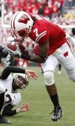 <b>Cornerback Aaron Henry scoops up a blocked punt and returns it for a touchdown in Wisconsin's 37-0 win over Purdue on Oct. 31, 2009 (AP Photo/Andy Manis)</b>