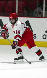 <b> Former Badger (in Wisconsin uniform) Kerry Weiland scored a goal in Team USA's 4-0 win over the Hockey East All-Stars