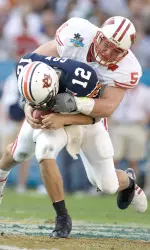 <b>Mike Newkirk records a sack against Auburn in the 2006 Capital One Bowl. Wisconsin won 24-10.</b>