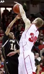 <b>Jon Leuer blocks a shot by Grambling State's Torez Young.</b>