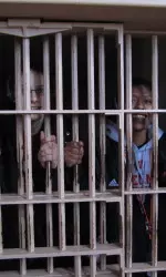 <b> Senior Lin Zastrow and junior Jade Davis pose for a photo in one of the cells at the prison on Alcatraz Island </b>