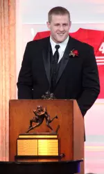 <b>J.J. Watt accepts the 2010 Lott IMPACT Trophy at a banquet in Newport Beach, Calif.</b>