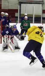 <b>Brianna Decker takes a shot on former UW goaltender Jessie Vetter toward the end of their morning practice. </b>
