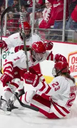 <b>The trio of Decker, Duggan and Knight celebrate a goal at the Kohl Center.</b>