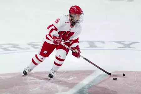 Anne Dronen (06) handles the puck during the Badgers' 8-4 win over North Dakota at the Kohl Center Feb. 13, 2011. Photo by David Stluka