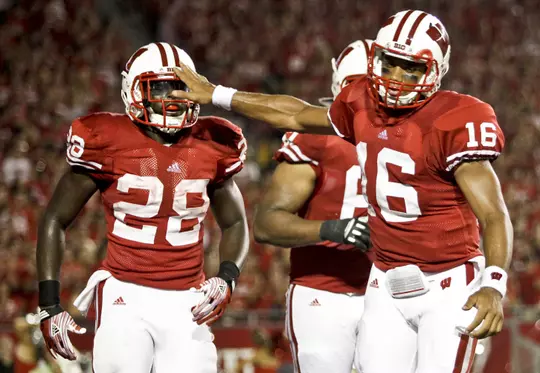 Wisconsin quarterback Russell Wilson (16) congratulates running back Montee Ball (28) after Ball's touchdown run during the first half of an NCAA college football game against UNLV, Thursday, Sept. 1, 2011, in Madison, Wis. (AP Photo/Andy Manis)