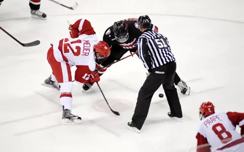 Keegan Meuer fights for the faceoff
