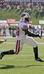 Montee Ball carried the ball 27 times for 198 yards and three touchdowns. He moved into second-place on Wisconsin's career touchdown list