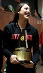 <b>Lauren Carlini carries the Gatorade National Player of the Year trophy.</b>