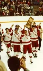 <b>Badger skaters show of the 1983 NCAA Championship trophy following a 6-2 win over Harvard.</b>