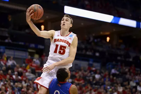F Sam Dekker (15) drives to the basket during the Badgers' second-round NCAA tournament game vs. American, March 20, 2014 (David Stluka photo)
