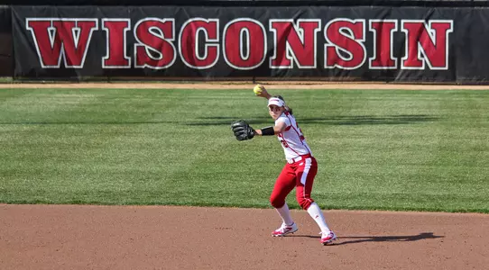 Ashley Van Zeeland (32) throws to first base during the first game of the Badgers' doubleheader vs. Purdue, April 25, 2014 (Brian Mason photo)