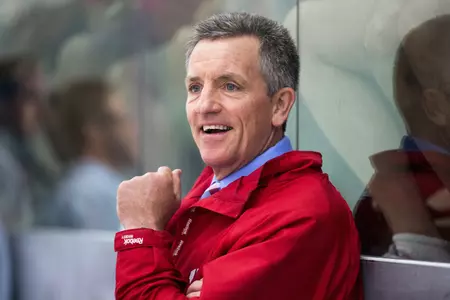 Mark Johnson smiles on the bench at the Blake Geoffrion Hockey Classic. (Photo by David Stluka).