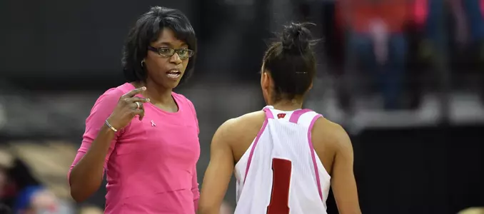 Coach Bobbkie Kelsey chats with Dakota Whyte on the sidelines