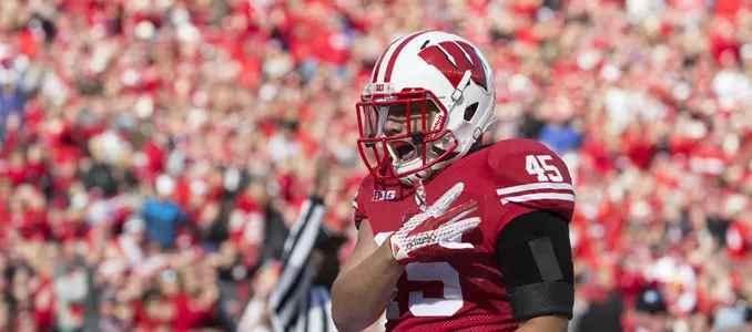 Alec Ingold celebrates a touchdown vs. Purdue