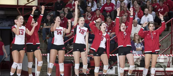 The Badger bench celebrates during a match