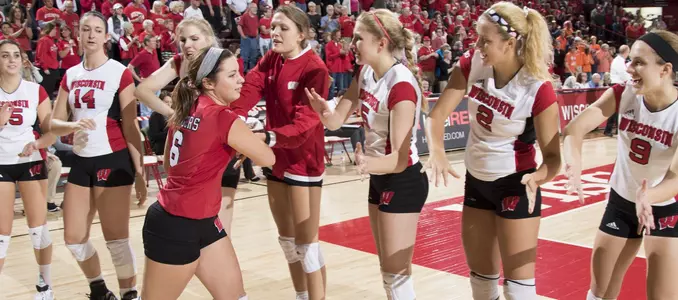 Taylor Morey slaps the hands of her teammates during starting lineups