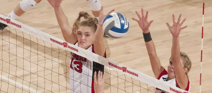 Haleigh Nelson and Kelli Bates go up for a block