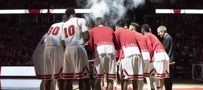 Badgers team huddle prior to game vs. UW-River Falls