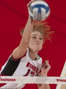 Haleigh Nelson puts a kill past an OSU blocker