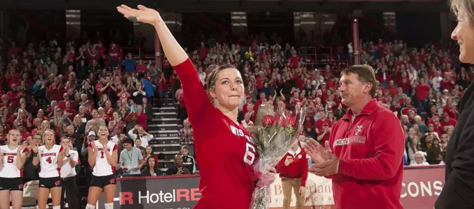 Senior Taylor Morey waves to the crowd on Senior Day