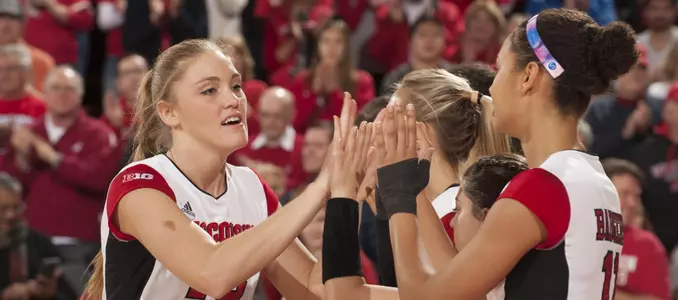 Haleigh Nelson slaps the hands of Tionna Williams during starting lineups