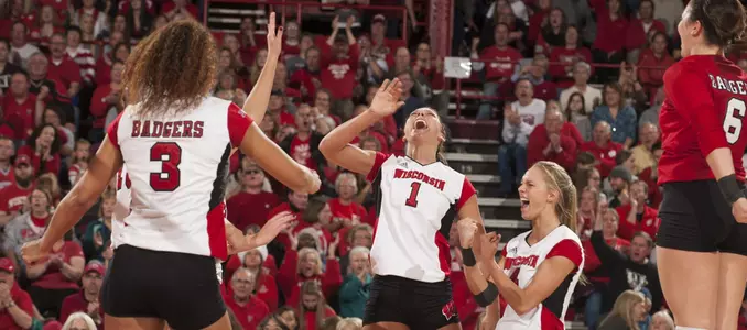 The Badgers celebrate on the court