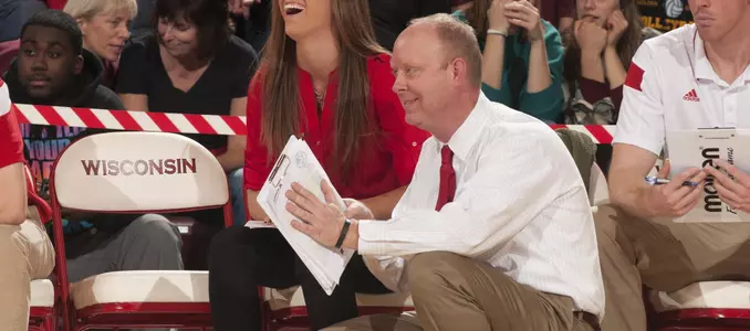 Kelly Sheffield laughing on the bench