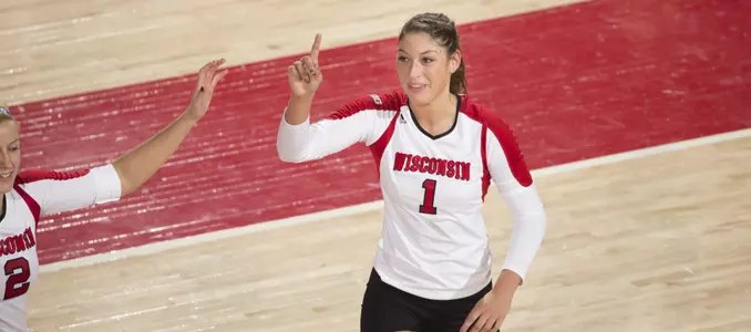 Lauren Carlini celebrates on the court