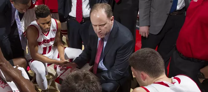 Greg Gard huddles with the team