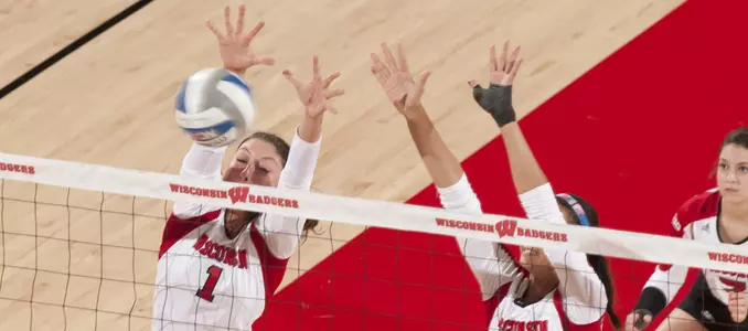 Lauren Carlini and Tionna Williams go up for a block