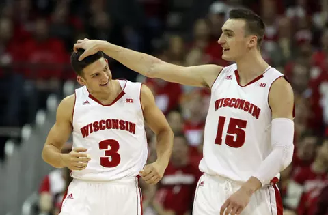 Feb 3, 2015; Madison, WI, USA; Wisconsin Badgers guard Zak Showalter (3) gets a head rub from Wisconsin Badgers forward Sam Dekker (15) at the Kohl Center. Wisconsin defeated Indiana 92-78. Mandatory Credit: Mary Langenfeld-USA TODAY Sports