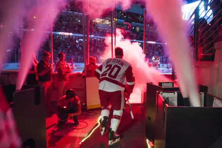 Eddie Wittchow (20) runs out onto the ice at the Kohl Center on Nov. 7th, 2014 against North Dakota (Larry Radloff photo)