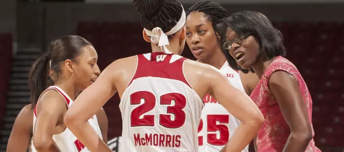 Head coach Bobbie Kelsey in a huddle with her team
