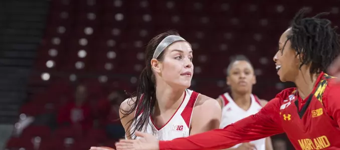 Tessa Cichy (22) looks to pass