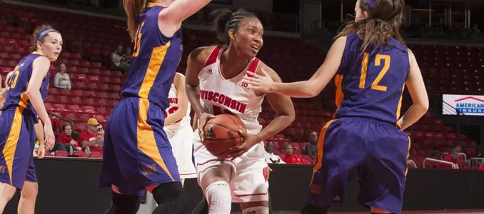 Marsha Howard battles for the ball between two defenders