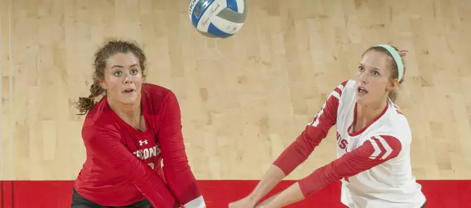 M.E. Dodge and Kelli Bates fight for a dig