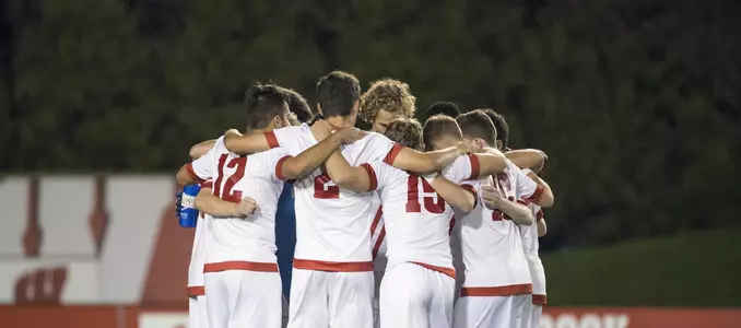 Mens soccer huddle