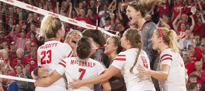 The Badger volleyball team celebrates its win over Penn State