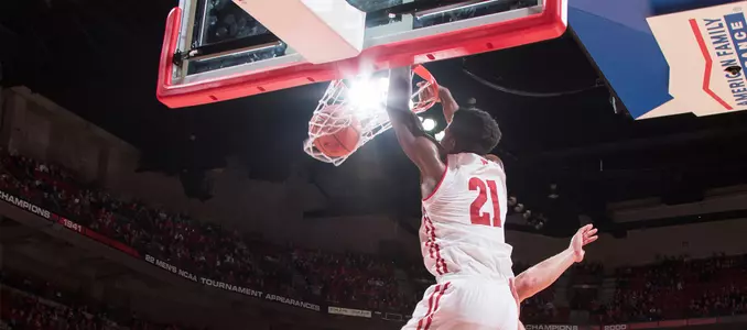 Khalil Iverson dunks during an exhibition vs. UW-Platteville