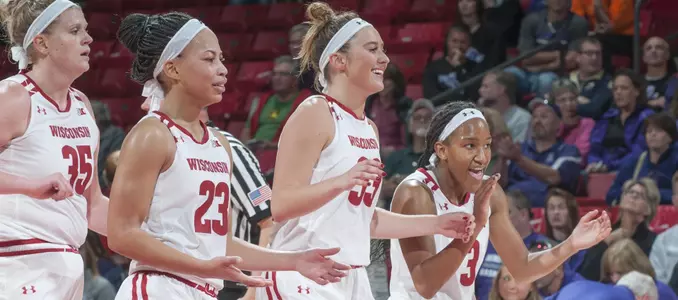 The Badger team celebrates on the floor