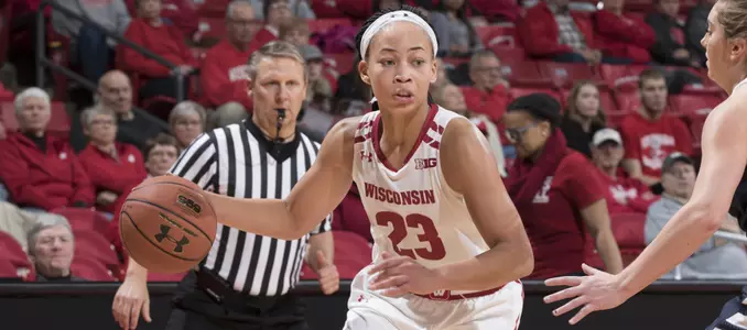 Cayla McMorris drives past a defender