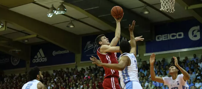 Ethan Happ goes for a shot against North Carolina at the Maui Invitational