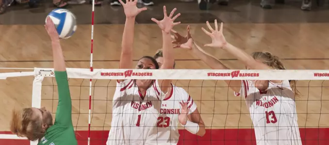 Lauren Carlini and Haleigh Nelson go up for a block