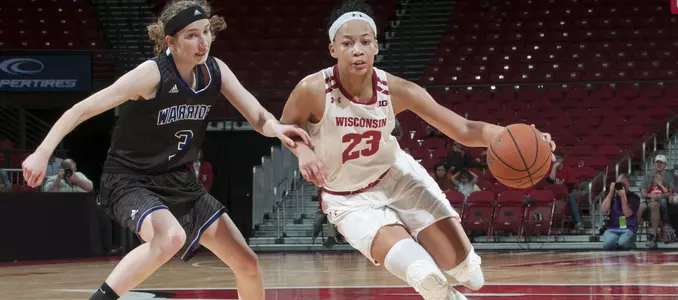 Cayla McMorris drives past a WSU defender