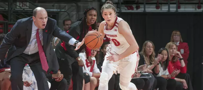 Kendra Van Leeuwen brings the ball up the court